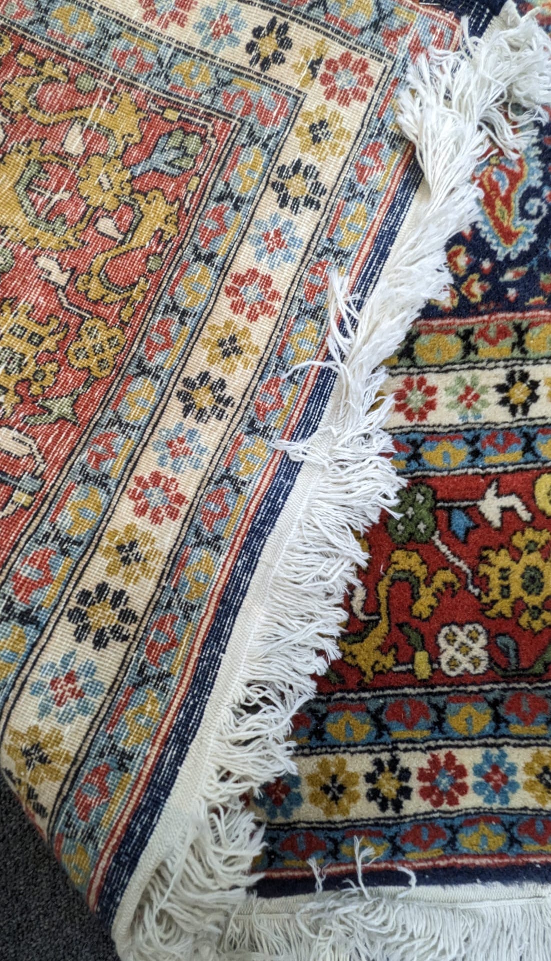 A Hereke blue ground carpet with central field of boteh motifs, 276 x 186cm